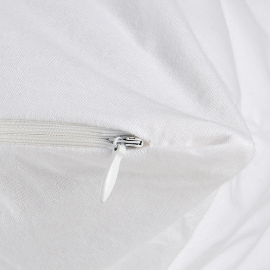 Close-up of a white comforter with a zipper on a white background