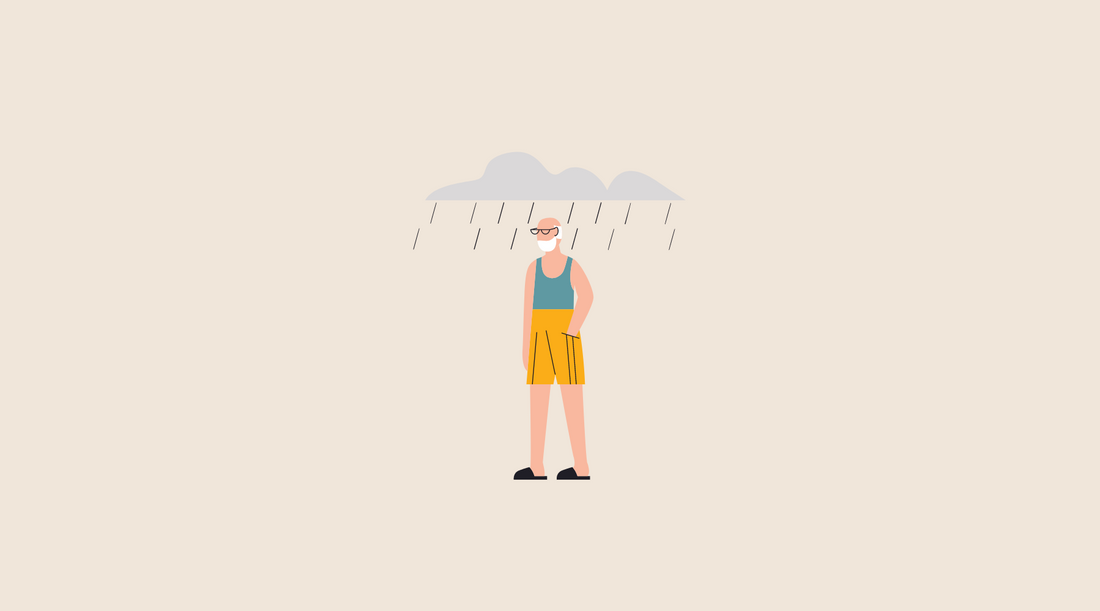 Man in summer clothes with rain clouds above him