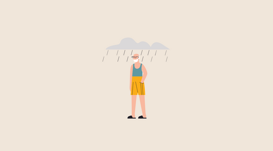 Man in summer clothes with rain clouds above him