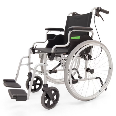 Photo of Freheit Freedom manual - a lightweight manual wheelchair with a silver frame, black seat, flip-up desk armrests, and solid wheels.
