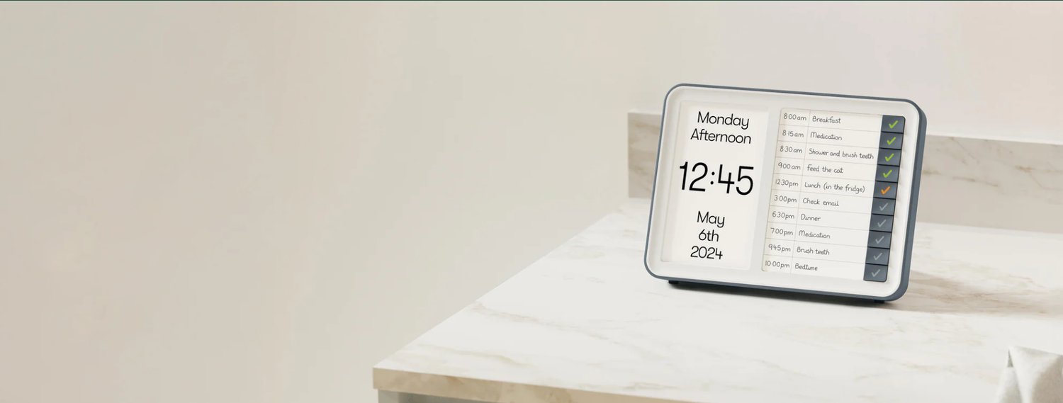 Digital clock displaying time and date on a white surface