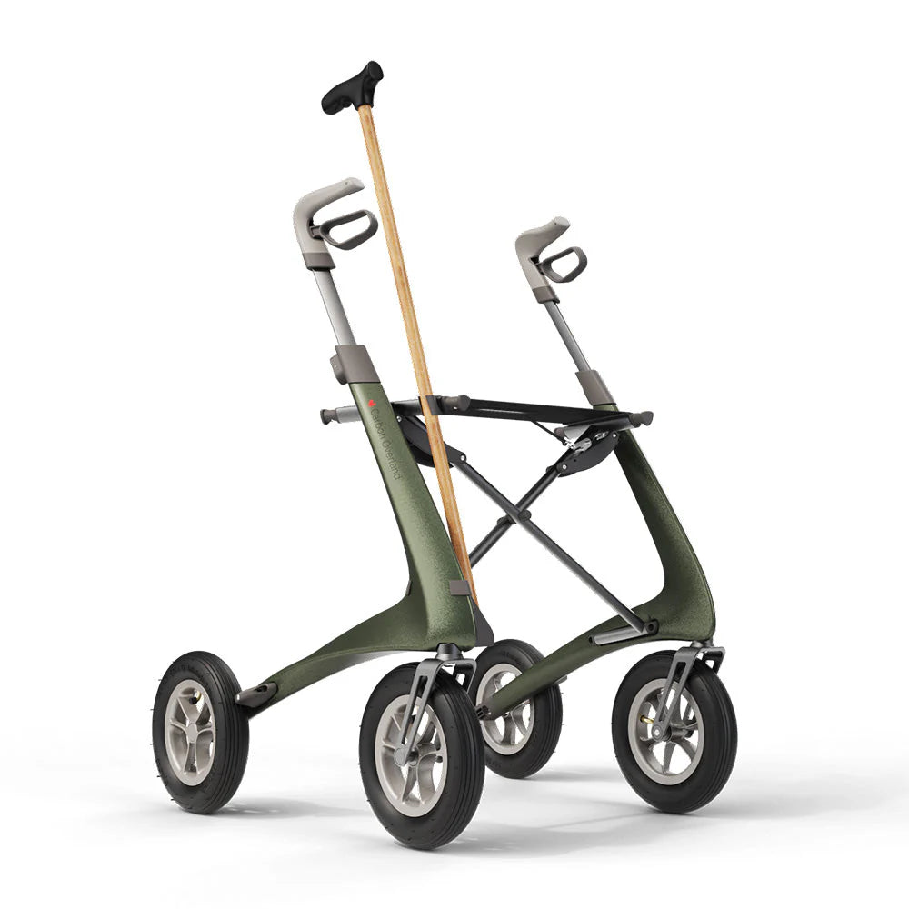Green Overland rollator with cane attached to cane holder clip and bottom bracket
