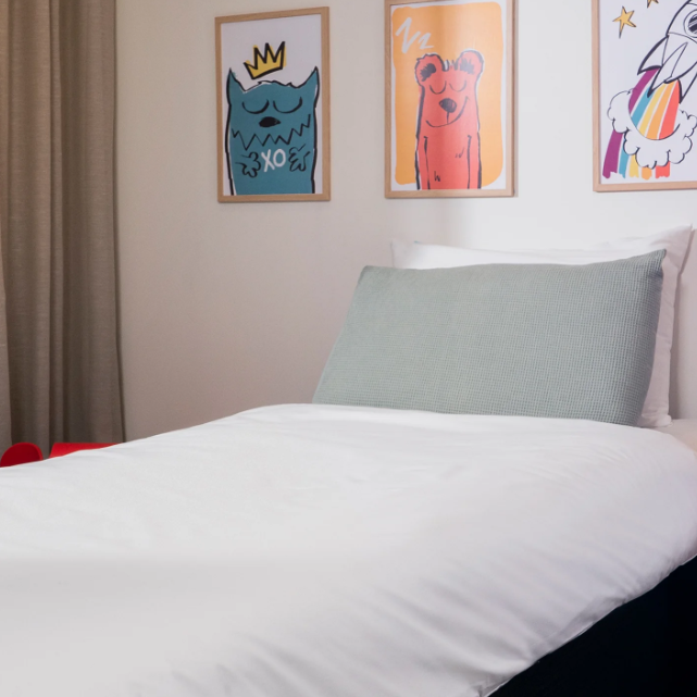 Bedroom with a bed featuring a duvet protector